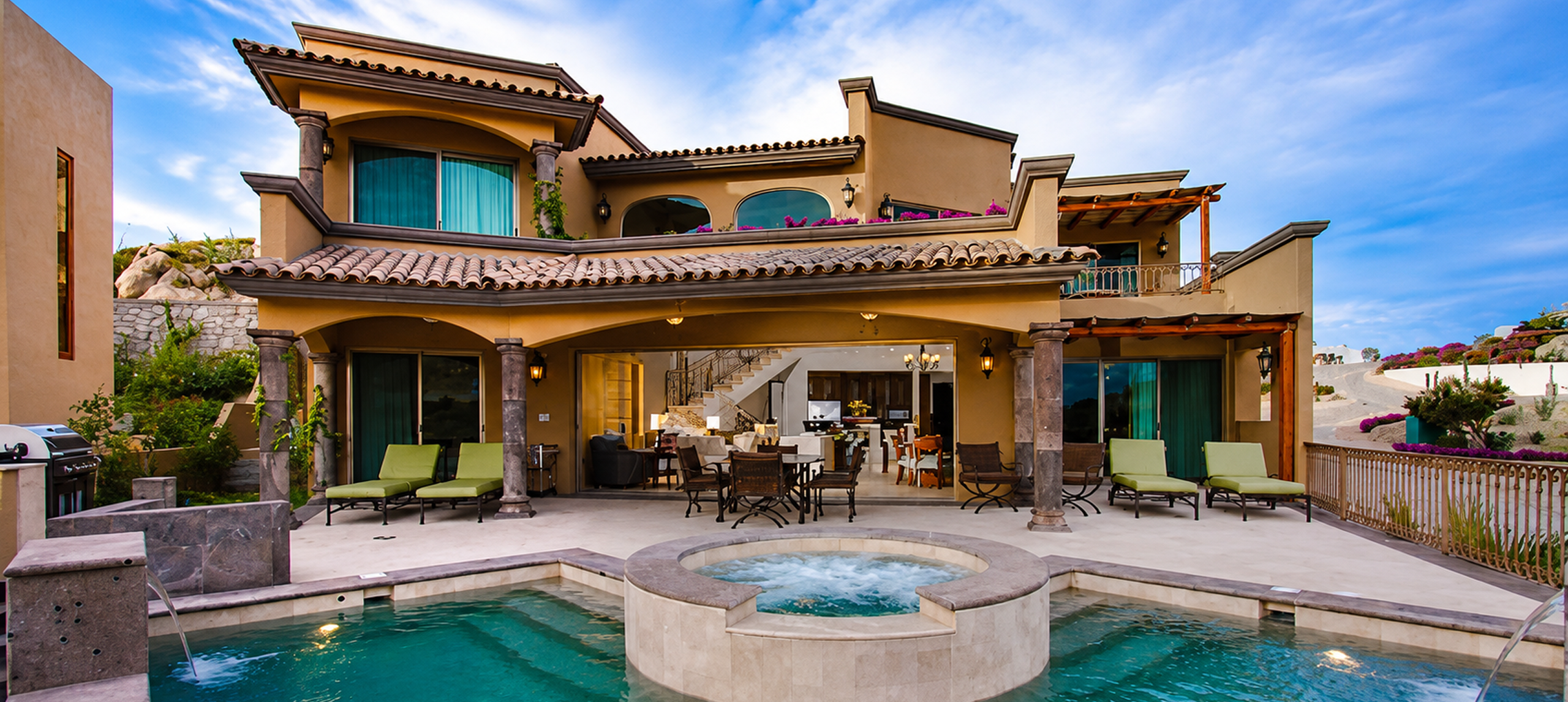 Luxurious villa with pool and patio area.