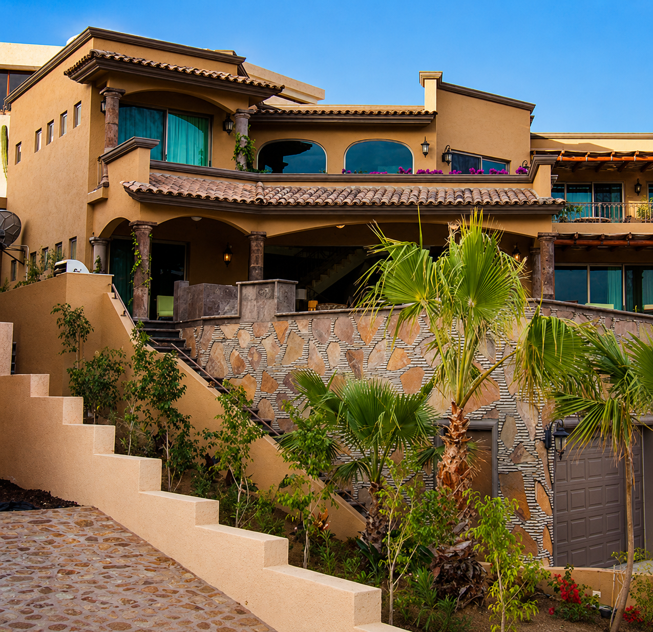 Mediterranean-style house with lush green plants.